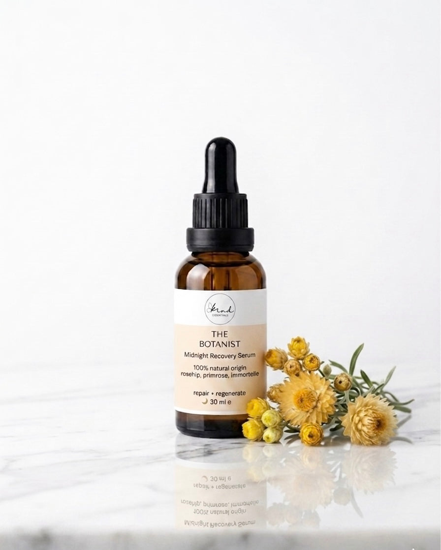 Kind Essentials The Botanist Midnight Recovery Serum on a marble top
