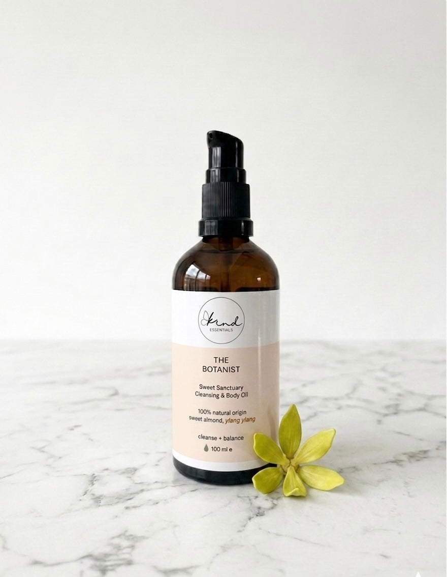 Kind Essentials The Botanist Sweet Sanctuary Cleansing & Body Oil on a marble top